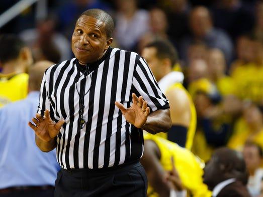 NCAA referee Ted Valentine reacts during the game between