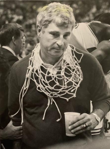 A victory net is draped around Bob Knight's neck after IU defeated Syracuse in 1987 for his third NCAA title.
